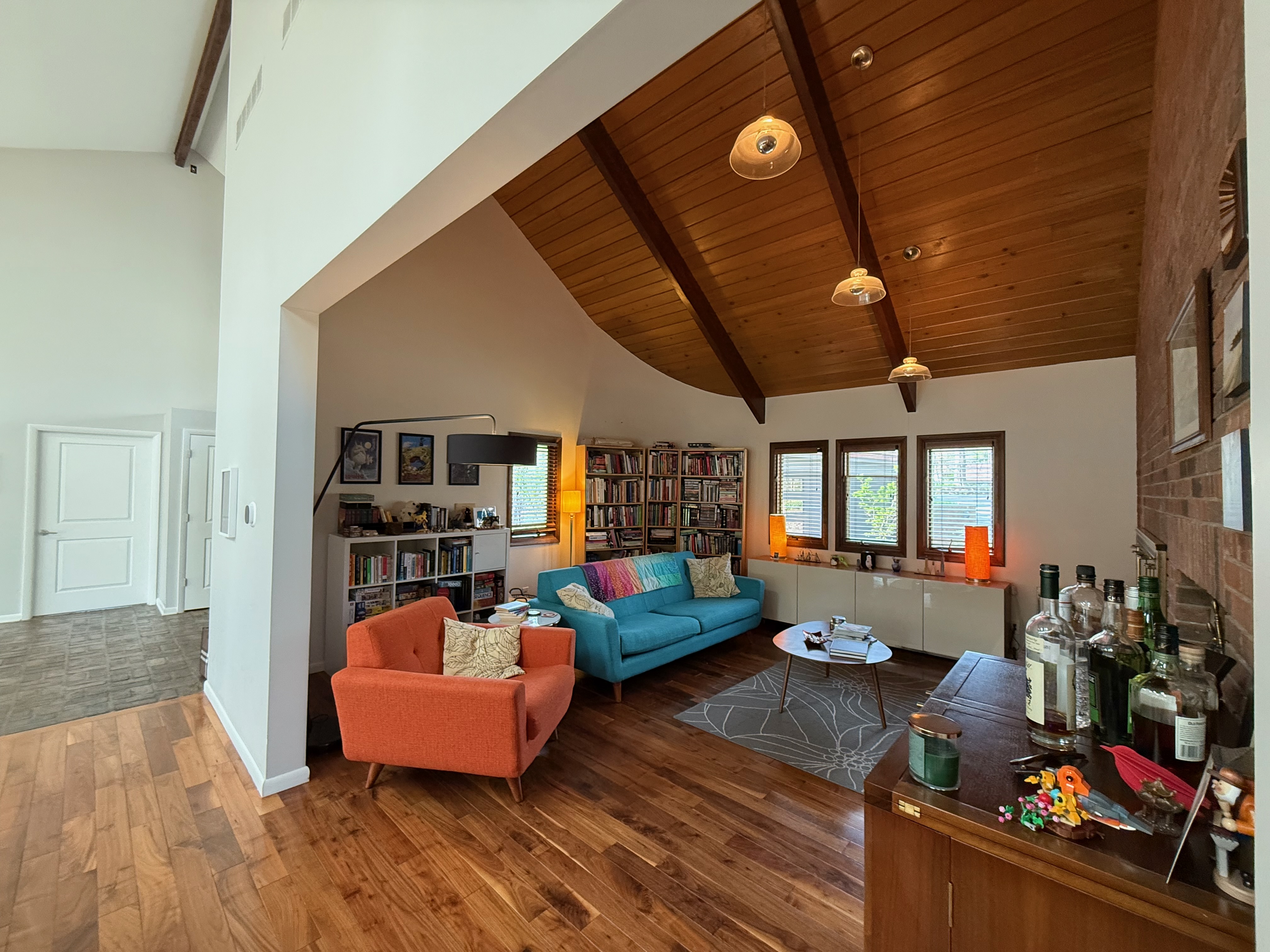 Living room with vaulted wood ceiling